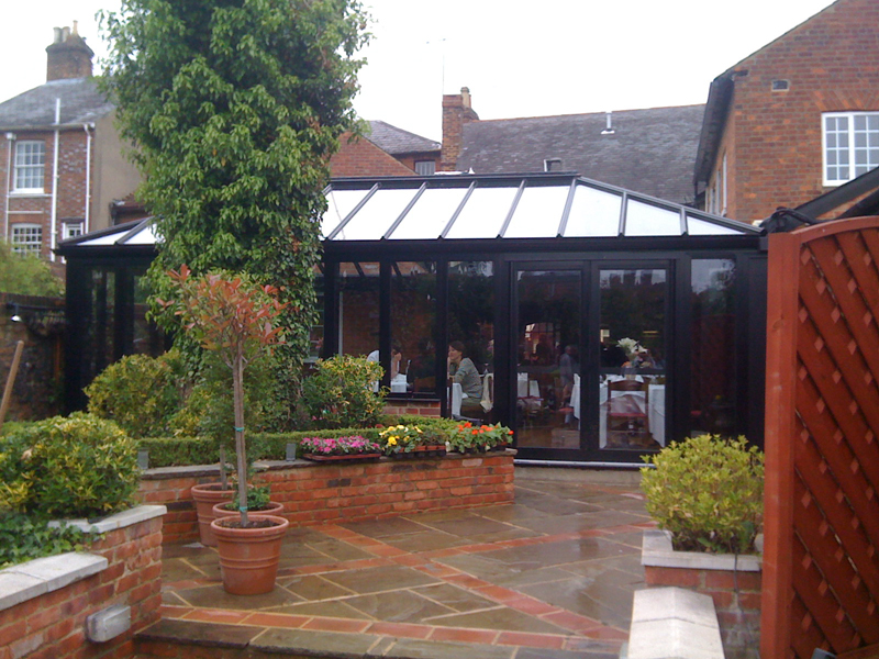 hipped back black aluminium conservatory